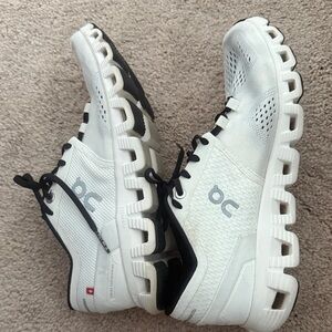 On Running White and Black Athletic Shoes